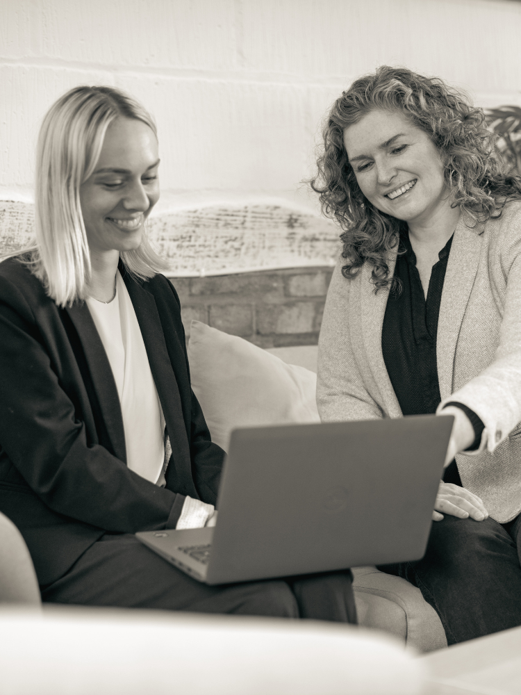 Tammy and Olivia family solicitors meeting in office with virtual client